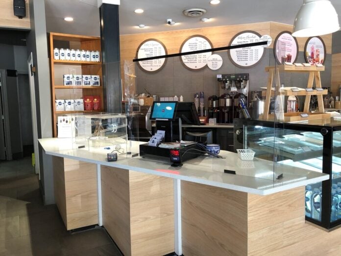 EXAMPLE OF PLEXIGLASS SHIELD AT CAFE COUNTER