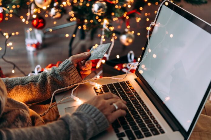 Woman shops online during the holiday period.
