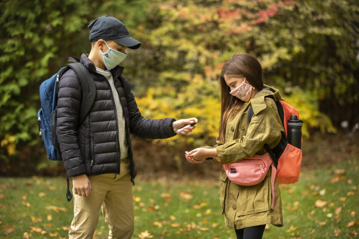 Children interacting with one another in McCarthy Uniforms' face masks. Photo: McCarthy Uniforms