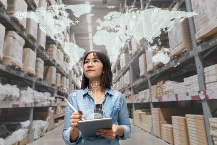 Entrepreneur in warehouse working on holistic omnichannel strategies