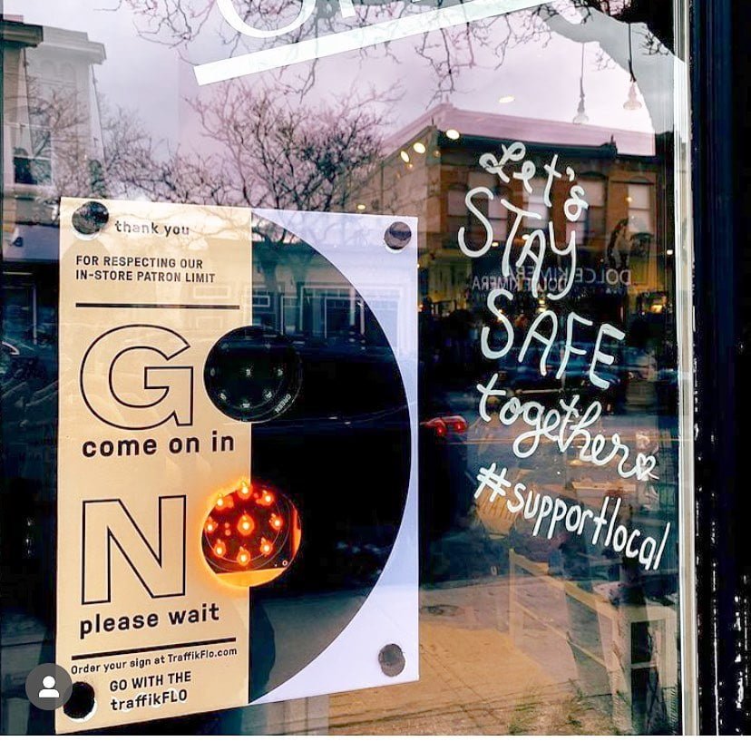 TraffikFlo system on front door of store also promoting #supportlocal. Photo: TraffikFlo Facebook