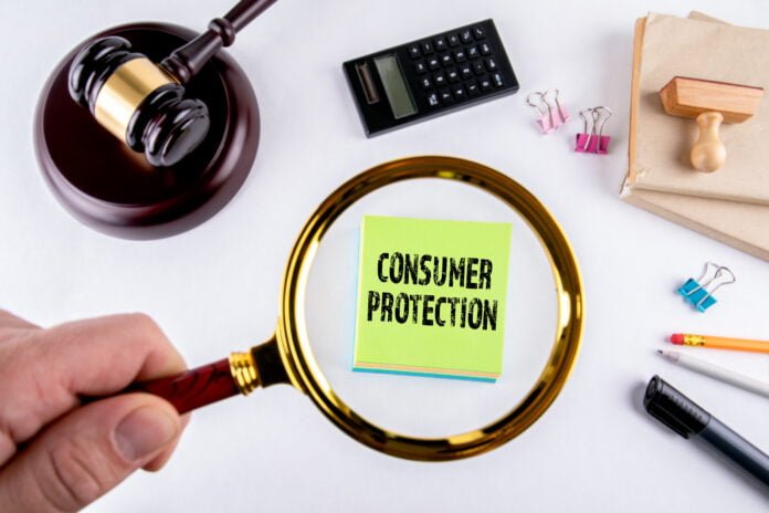 Consumer protection, law and justice concept Consumer protection, law and justice concept with man's hand holding magnifying glass.