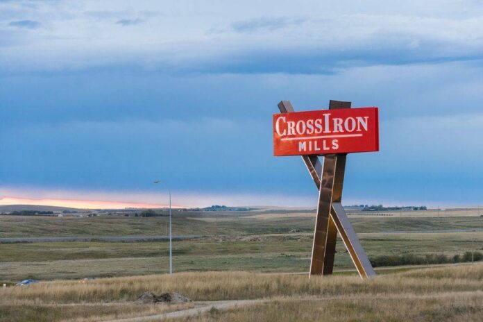 CrossIron Mills sign next to Highway 2 freeway connecting Calgary and Edmonton.