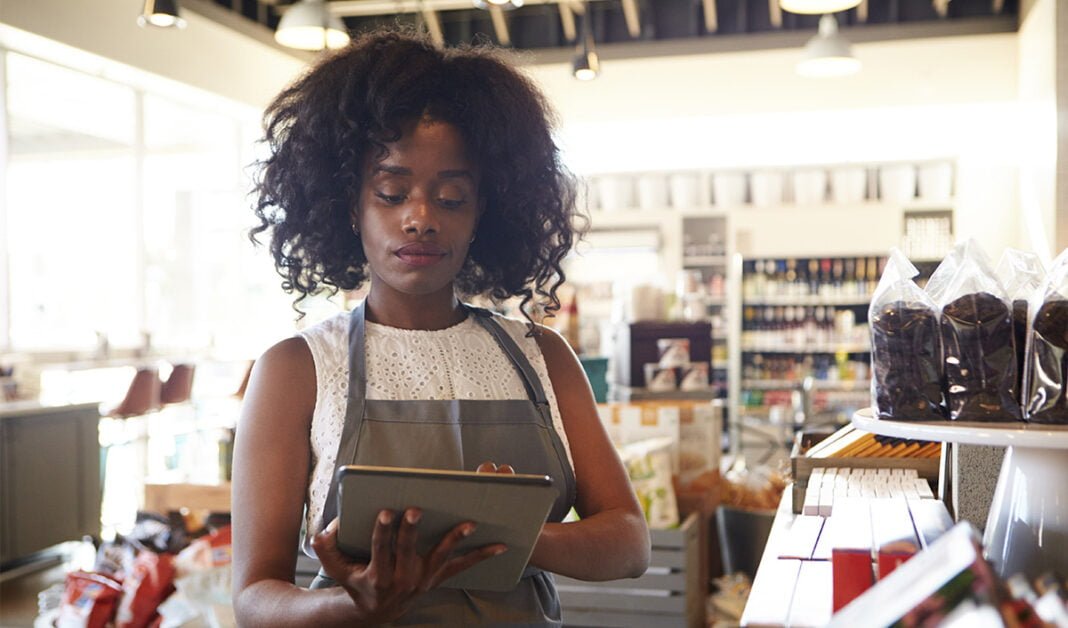 Retail worker using smart device
