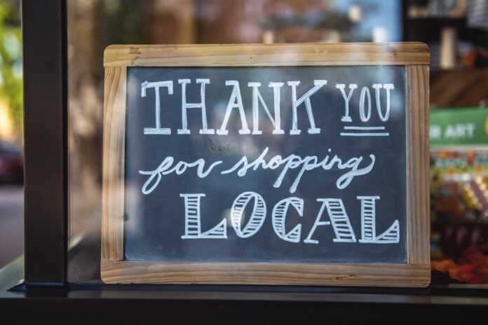 "Thank you for shopping local" sign.
