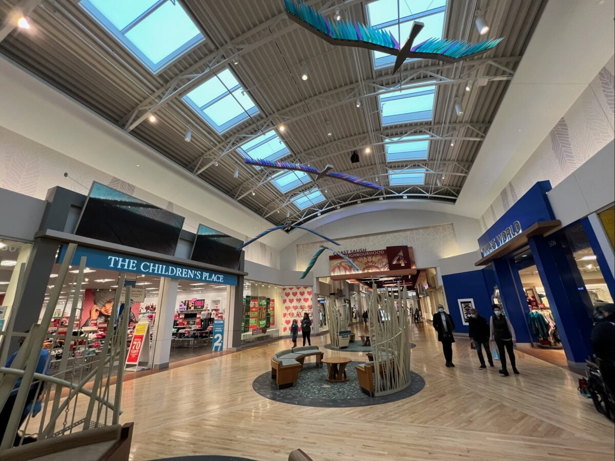 Seating Area between City Neighbourhood and Coast Salish Neighbourhood at Tsawwassen Mills in Delta, BC (December 2021). Photo: Lee Rivett.