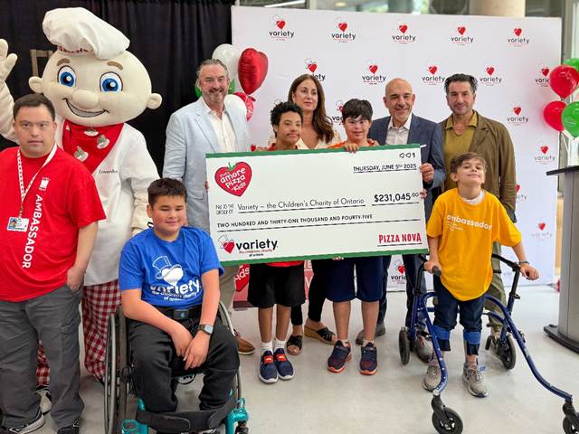 Domenic Primucci, president of Pizza Nova, back row, second from the right, joins Mike Primucci, far right, to present a cheque for $231,045 to Charlie Johnstone, CEO of Variety – The Children’s Charity of Ontario, third from the left, at Variety Village along with Ambassadors and family members, June 5, following Pizza Nova’s 2025 That’s Amore Pizza for Kids fundraiser.