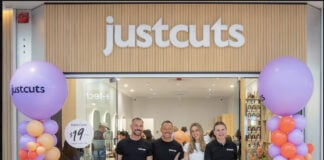 Just Cuts global team at grand opening for first Canadian salon