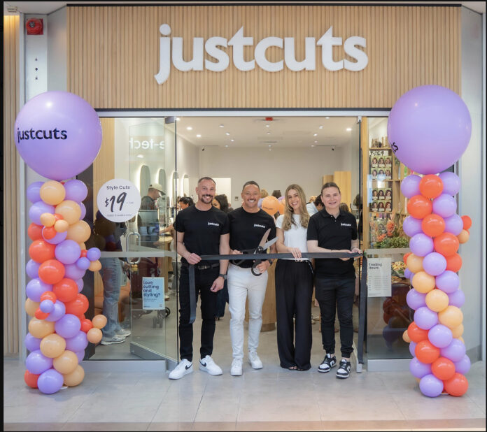 Just Cuts global team at grand opening for first Canadian salon